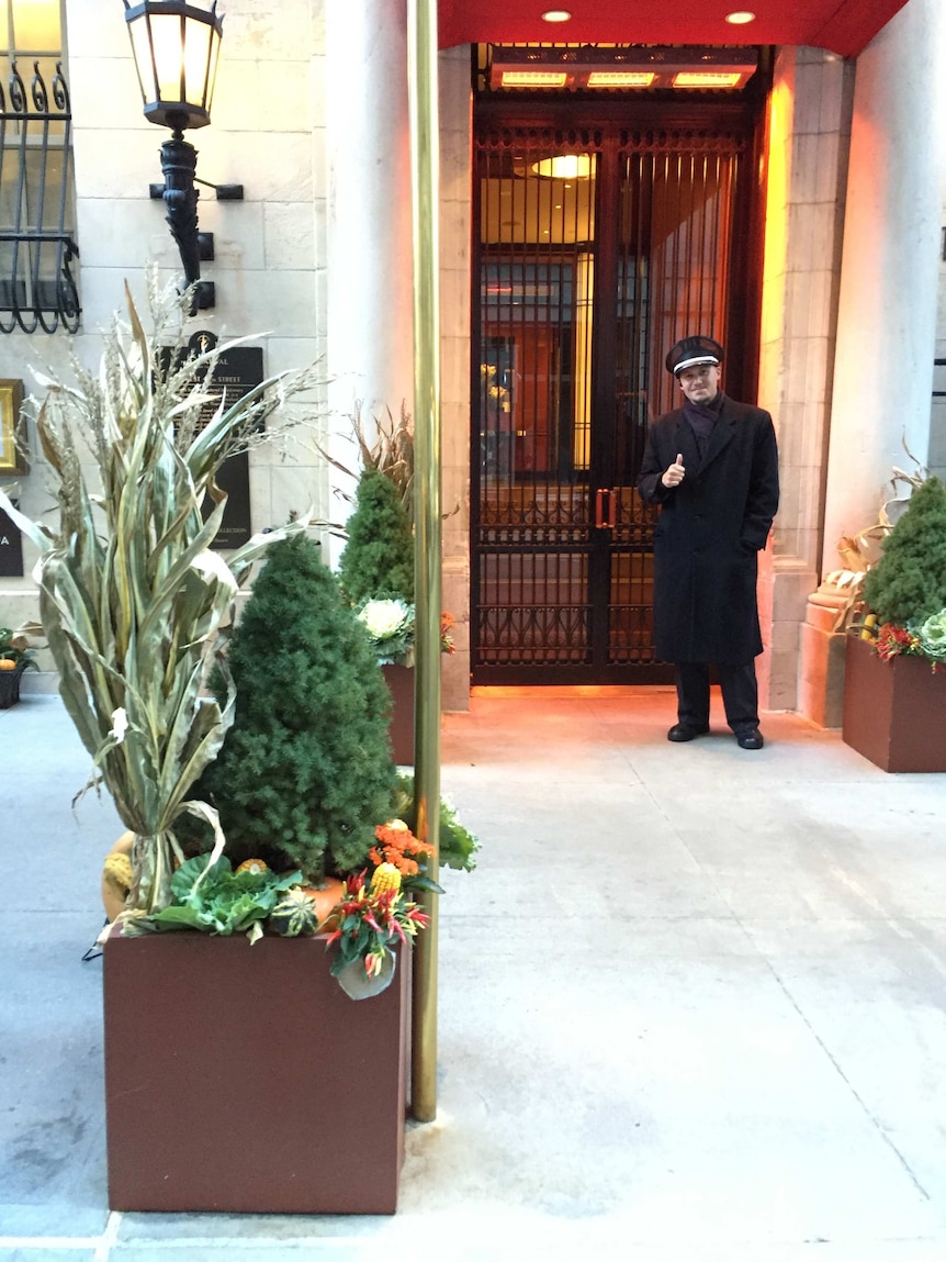 New York doorman Peter Castellano gives the thumbs up.