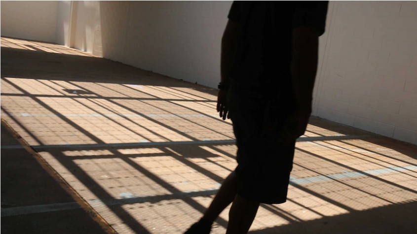 The shadow of a child in a detention centre