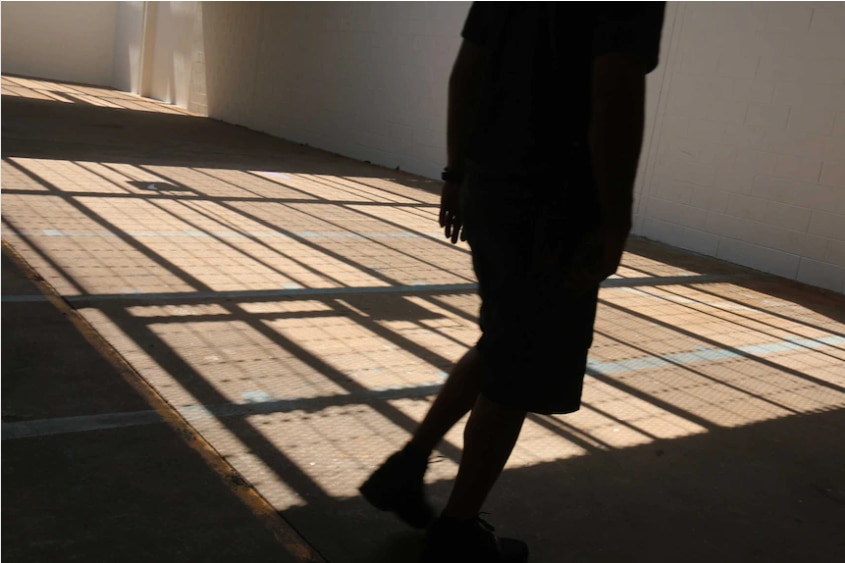 The shadow of a child in a detention centre