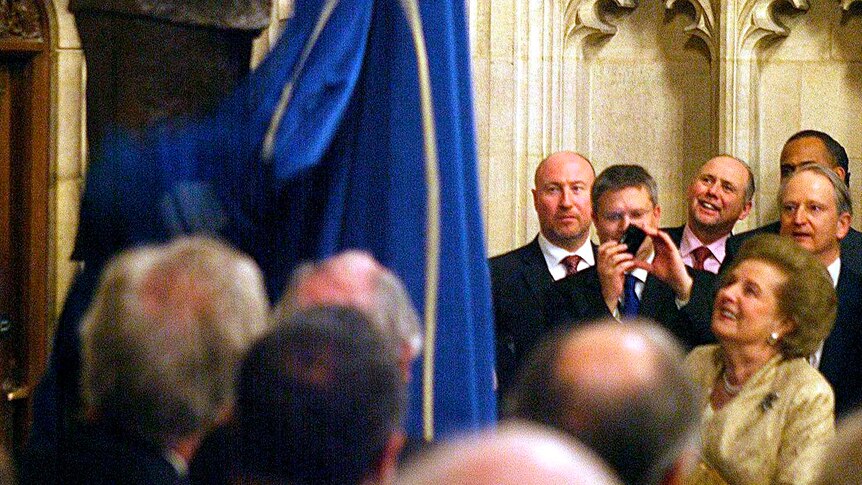 Margaret Thatcher unveils a bronze statue of herself.