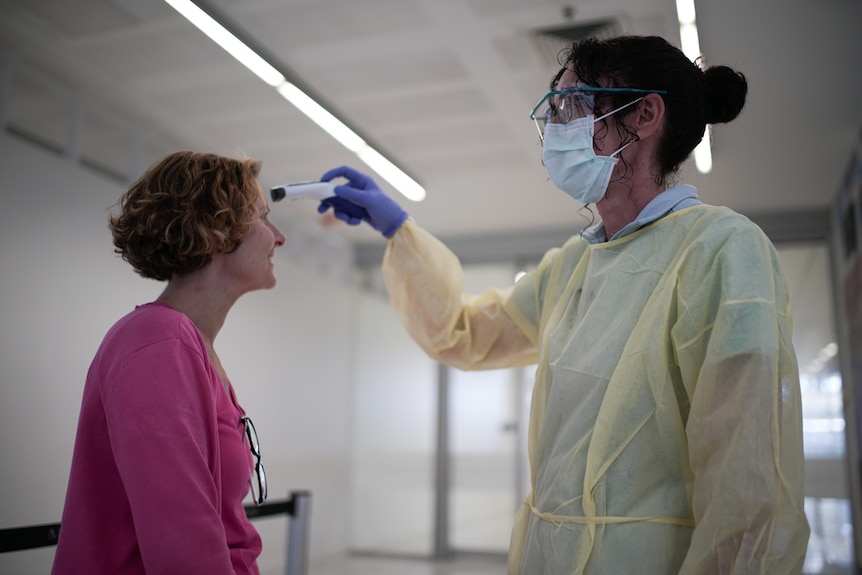 A medical worker carries out coronavirus testing.