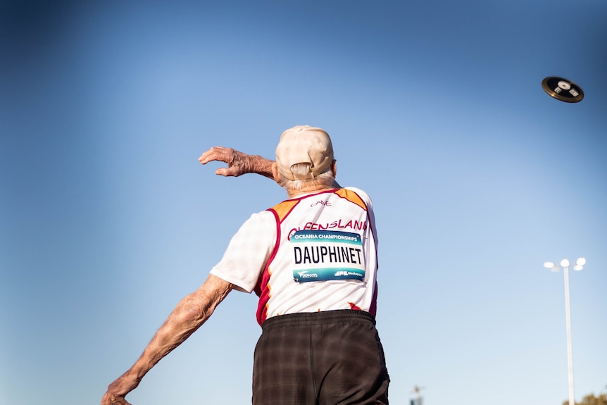 Bundaberg athlete Maurice Dauphinet, 96, throws the discus