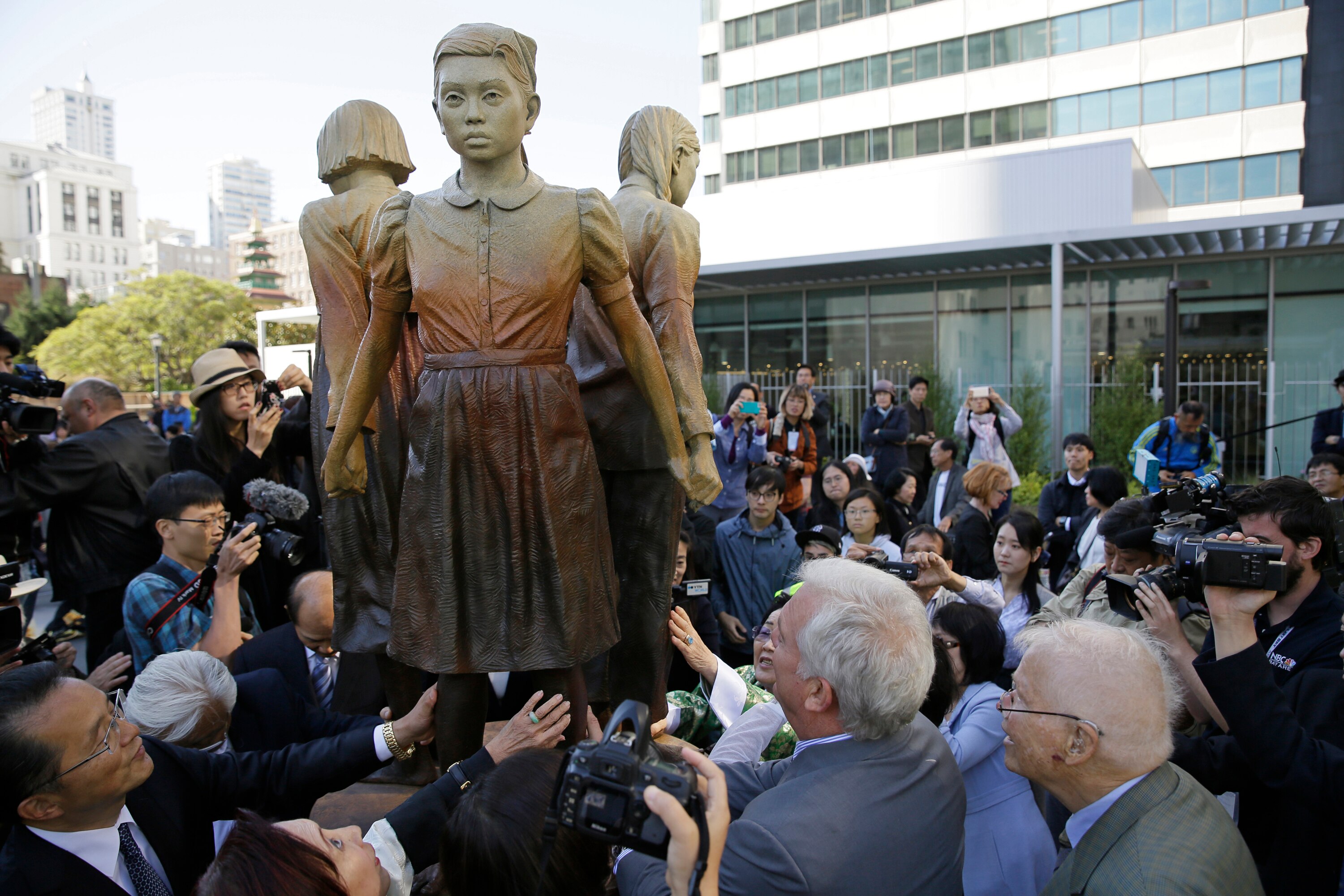 People move in to take a closer look at the "Comfort Women" monument in San Francisco
