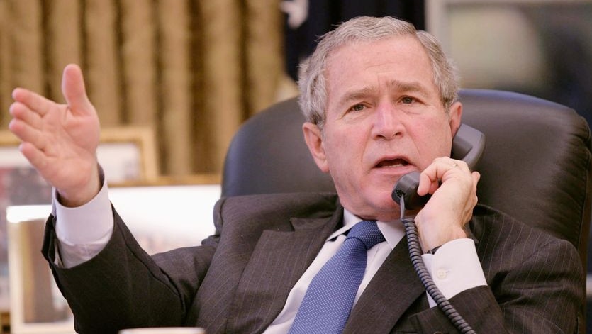 George W Bush speaks on the phone.