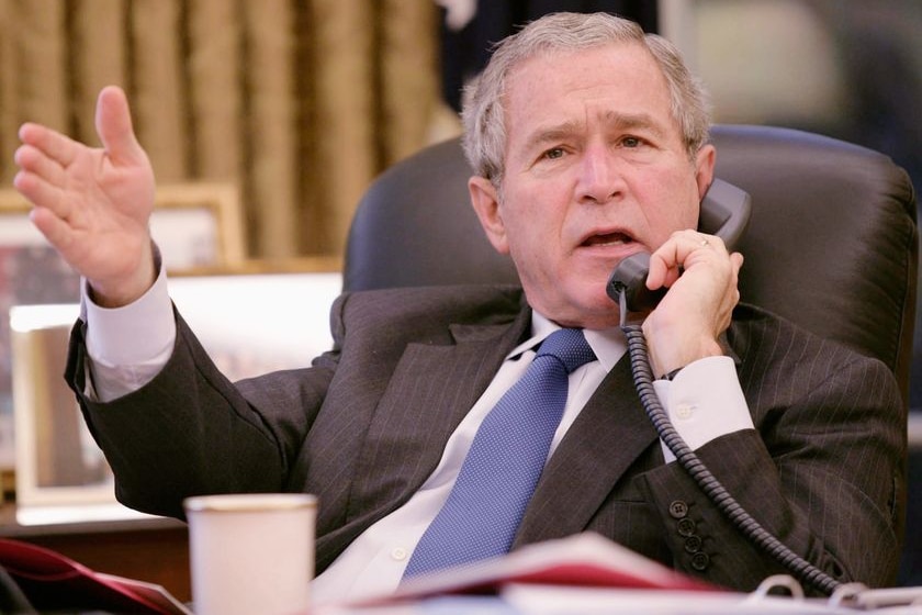 George W Bush speaks on the phone.