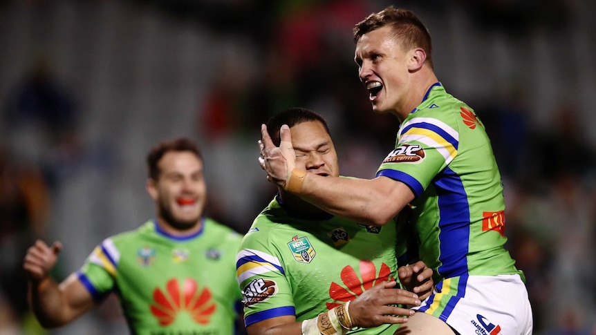 The Raiders' Joseph Leilua and Jack Wighton celebrate a try against Wests Tigers at Campbelltown.