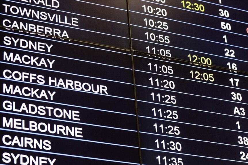 The arrival board with times at Brisbane airport.