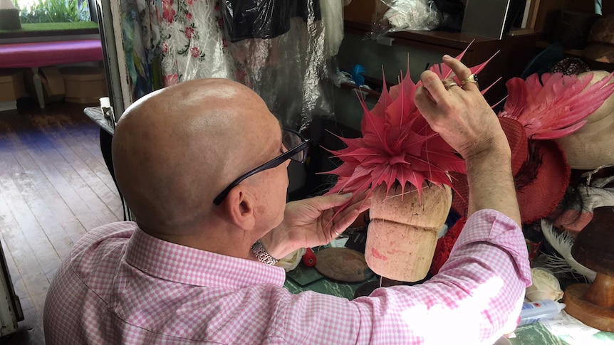 Neil Grigg crafting a pink fascinator