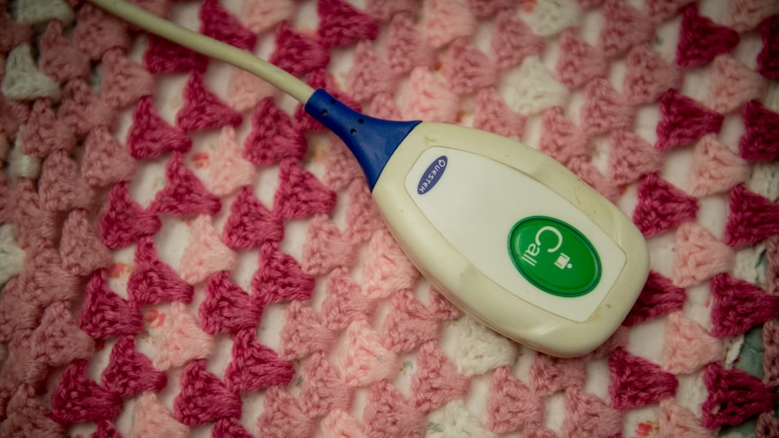 A close up photo of an emergency call button in an aged care home.