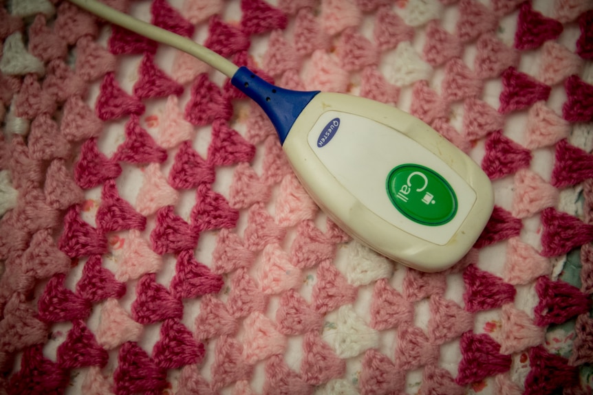 A close up photo of an emergency call button in an aged care home.