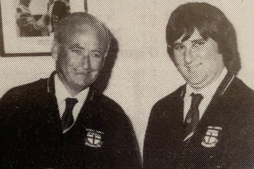 Albert Briggs and Trevor Gravell pose for a photo with their timekeeping clocks.