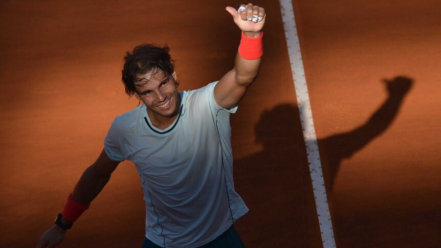 Rafael Nadal celebrates after beating Roger Federer in the Rome Masters final on May 19, 2013.