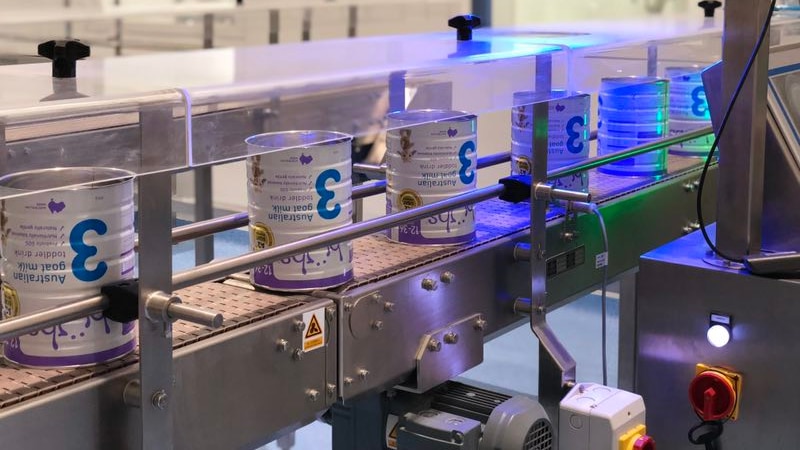 Baby formula tins on a production line 