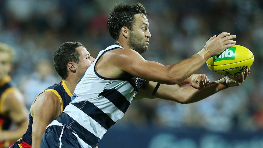 The Cats' Jimmy Bartel marks the ball during the round one match with Adelaide.