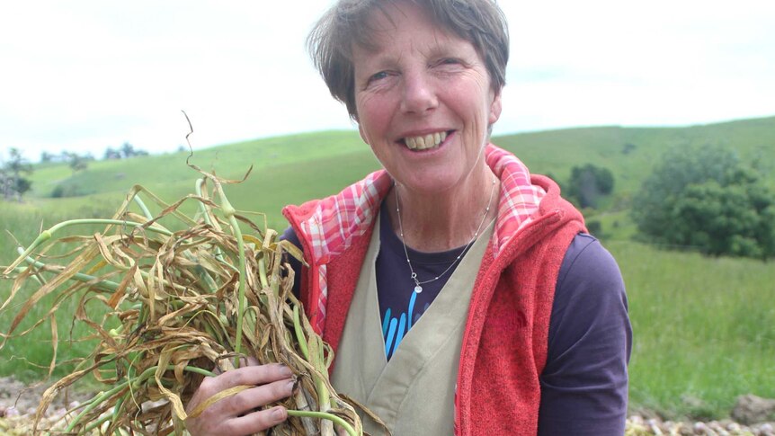 Garlic grower Kirsten Jones shows off some new season produce.