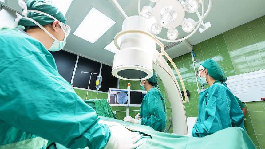 Doctors in an operating theatre.