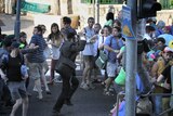 Yishai Shlissel raises a knife at a gay pride parade in central Jerusalem
