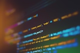 Likes of computer code seen on a screen, through a blurred lens