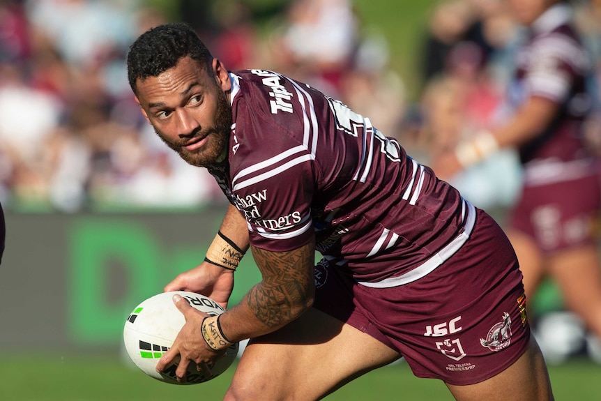 Api Koroisau passes the ball for Manly