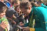 Cate Campbell signs autograph in Hobart