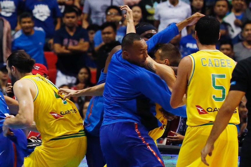 The Philippines and Australian basketball players react, during the FIBA World Cup Qualifiers.