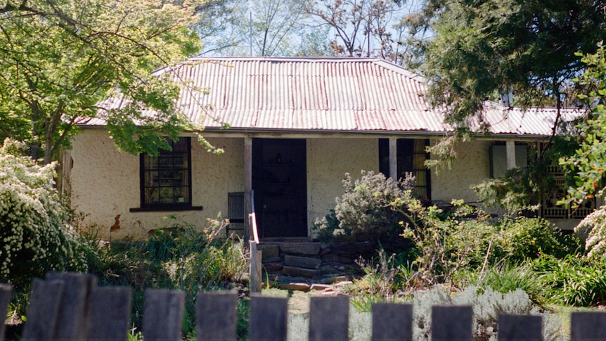 A cottage exterior with garden.