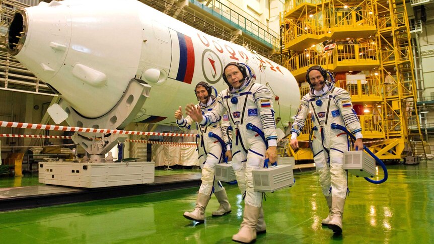 Astronaut and cosmonauts prepare for space launch