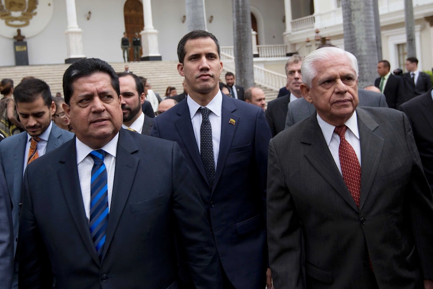 Edgar Zambrano, left, with Juan Guaido, centre, and Omar Barboza.