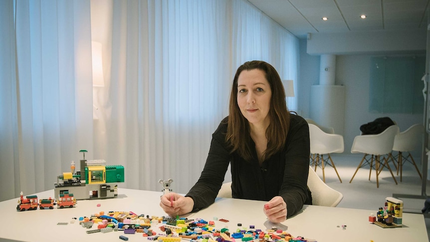 Australian Lego designer Melody Caddick holds a Lego Koala.