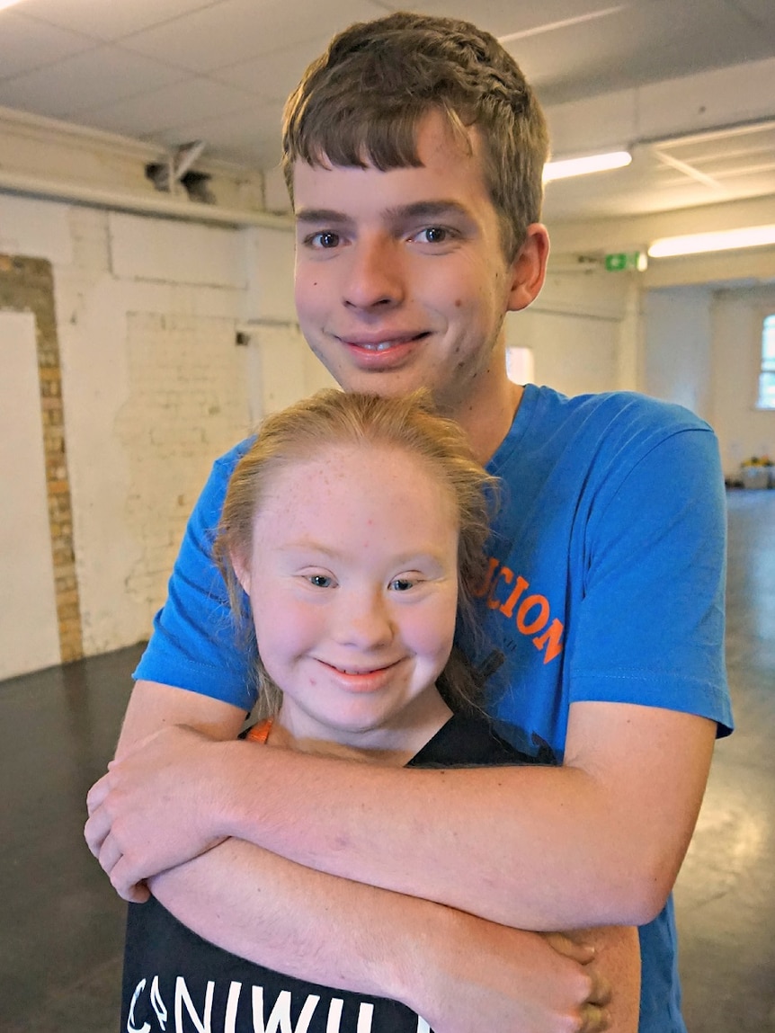 Madeline Stuart and her boyfriend Robbie Streeting hug.