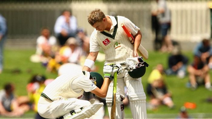 David Warner consoles Nathan Lyon.