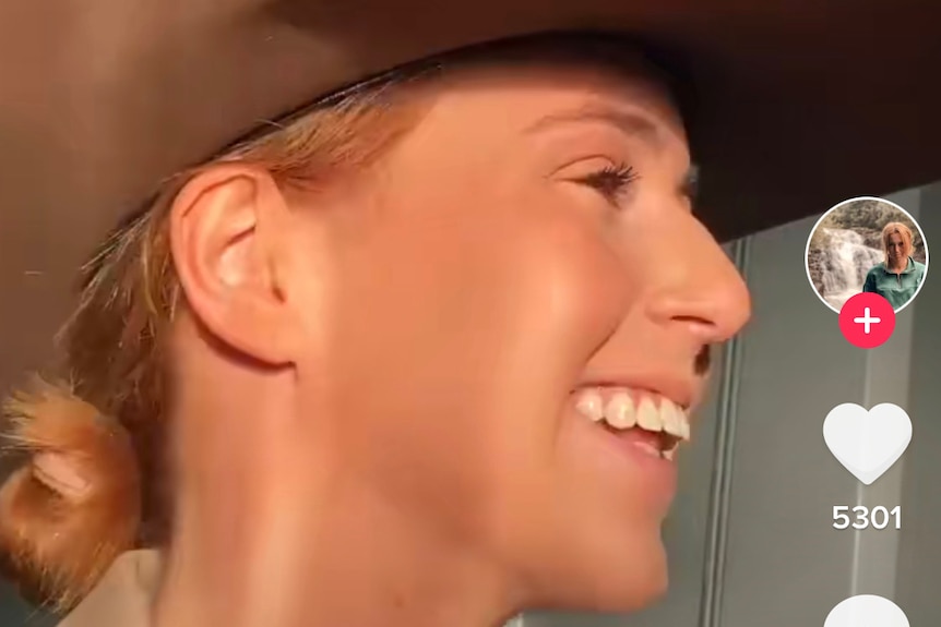 A young woman wearing a cowboy hat.