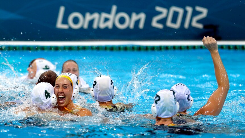 The Australian women's water polo team celebrate their bronze medal win over Hungary.