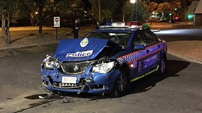 The NT Police car after it was driven into by a man allegedly hooning in a 4WD in Alice Springs.