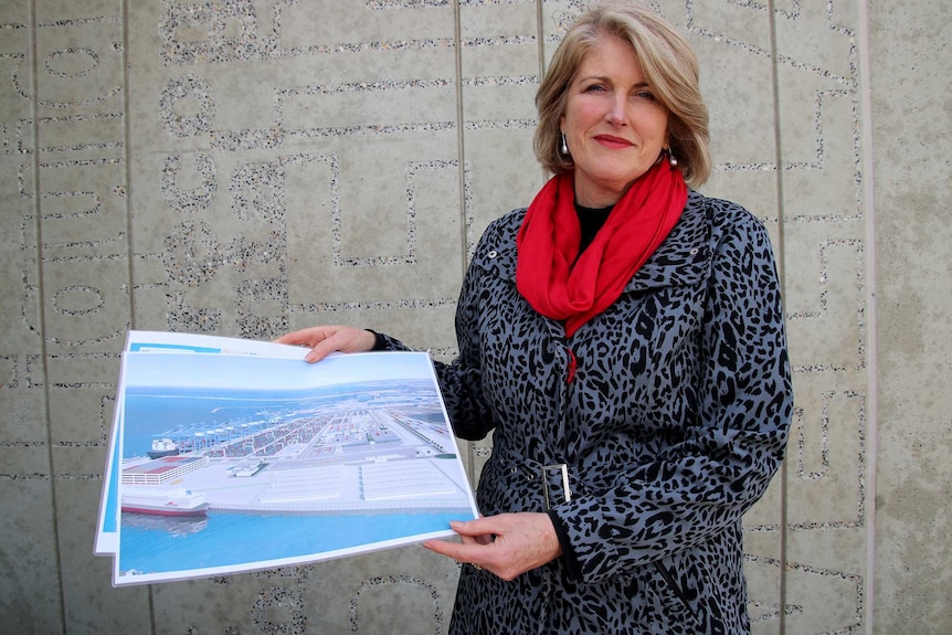 Kwinana mayor Carol Adams holds plans of the outer harbour.