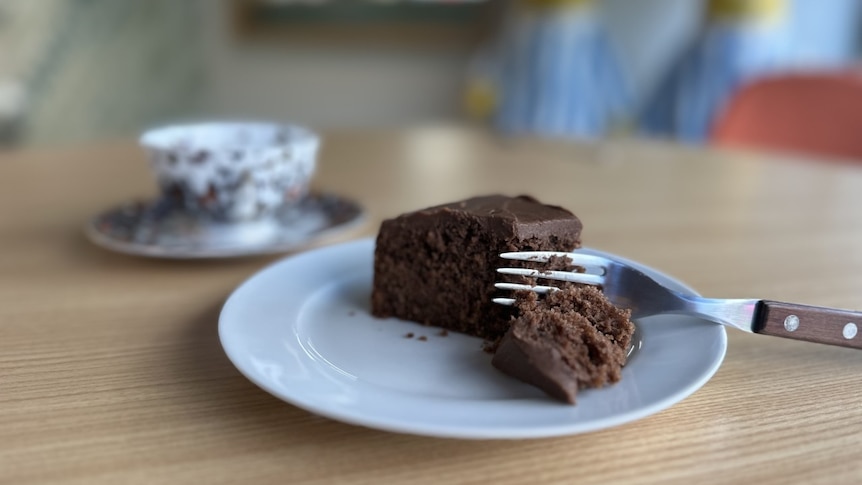 chocolate cake with fork and teacup