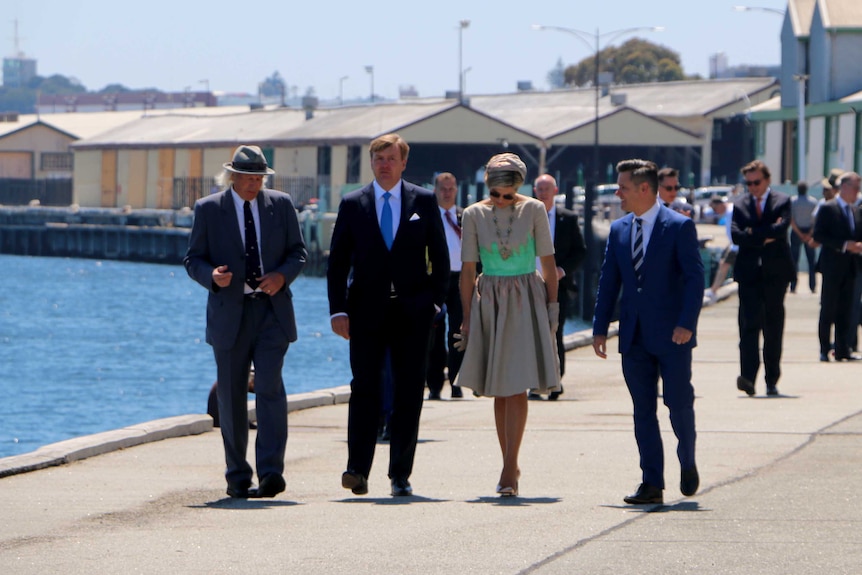 Historian Mike Lefroy, Dutch King Willem-Alexander, Queen Maxima and Fremantle Mayor Brad Pettitt walk along Fremantle wharf
