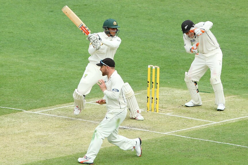 Usman Khawaja cuts against New Zealand on day one at the Gabba