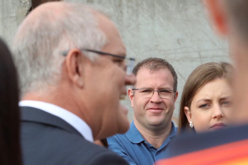 Ben Morton watches on as Scott Morrision holds a press conference at Parliament House