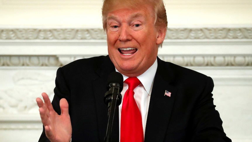 Donald Trump gestures with his hand as he speaks to governors.