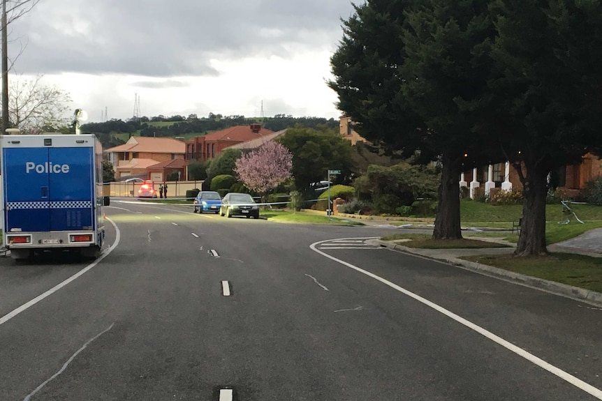 Police tape off a street after a man is shot dead in Narre Warren.