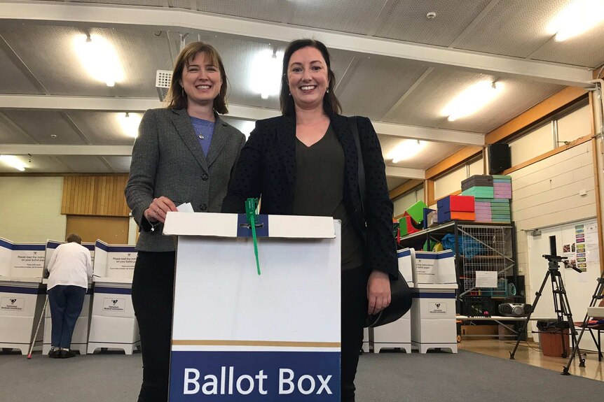 Joanna Siekja (r) casts her vote in Pembroke with Julie Collins