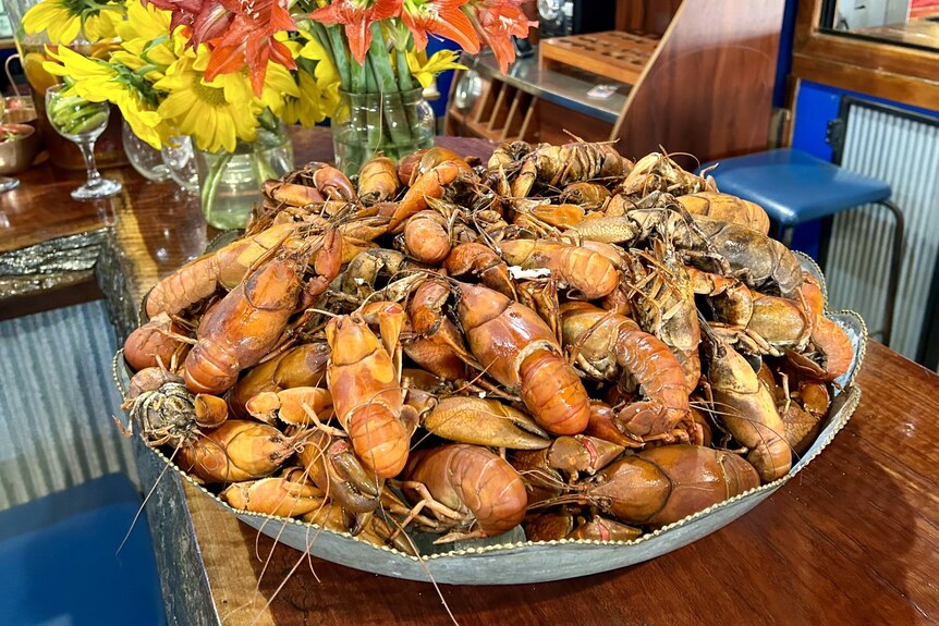 A large pile of cooked yabbies on a plate 