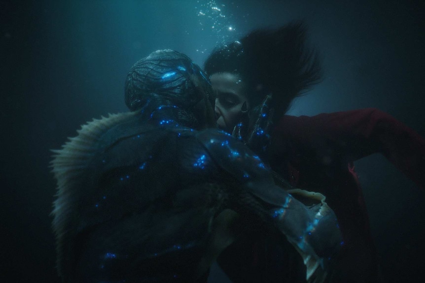 Sally Hawkins kisses the aquatic creature in the film, The Shape of Water.