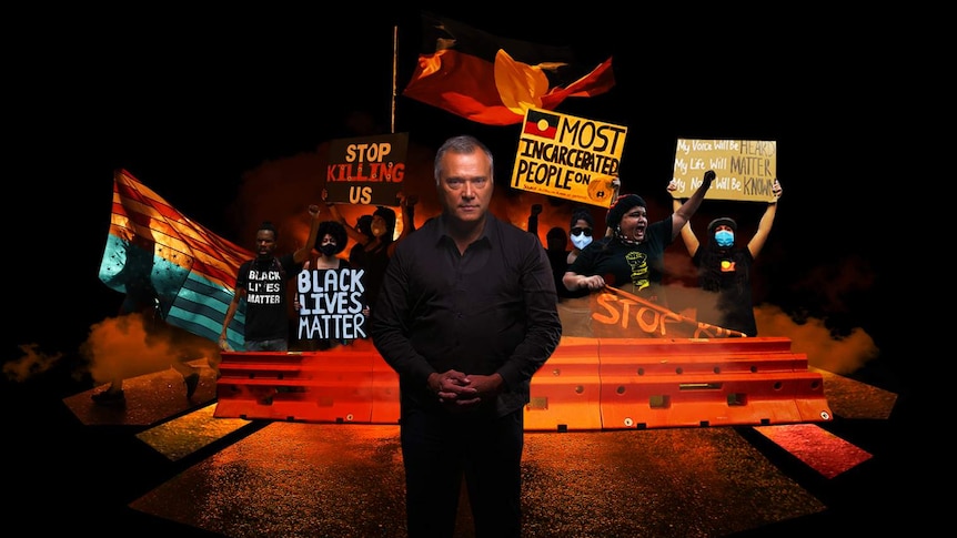 Stan Grant stands in front of Black Lives Matter protesters.