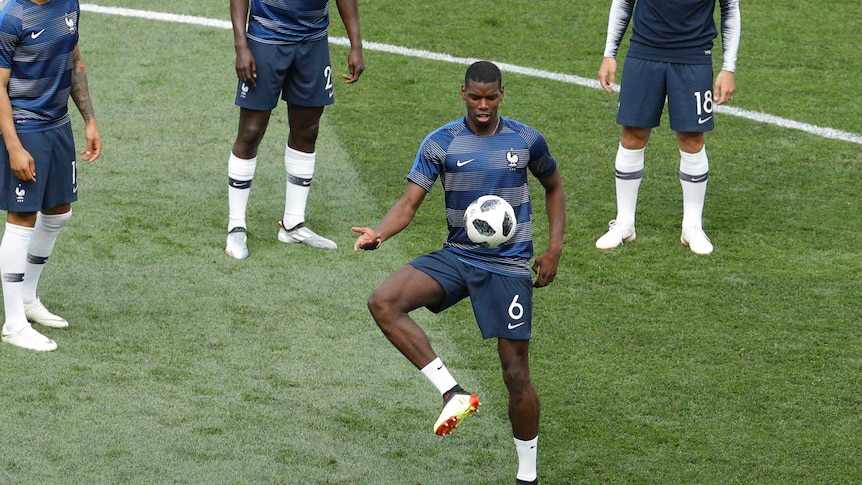 France's Paul Pogba juggles the ball in warm-up