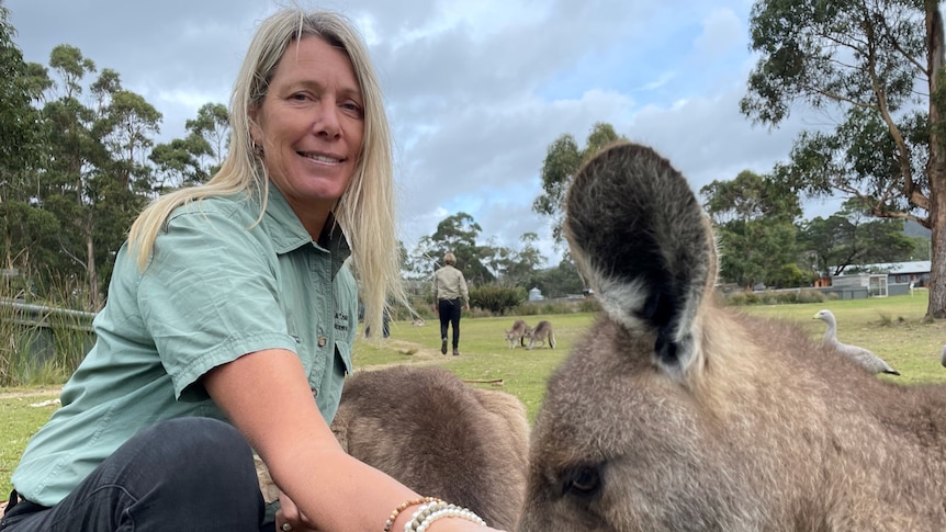 Jacqui Laning feeds a kangaroo