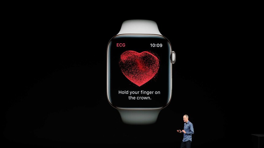 Jeff Williams, Chief Operating Officer of Apple stands on stage and introduces a new model of Apple Watch