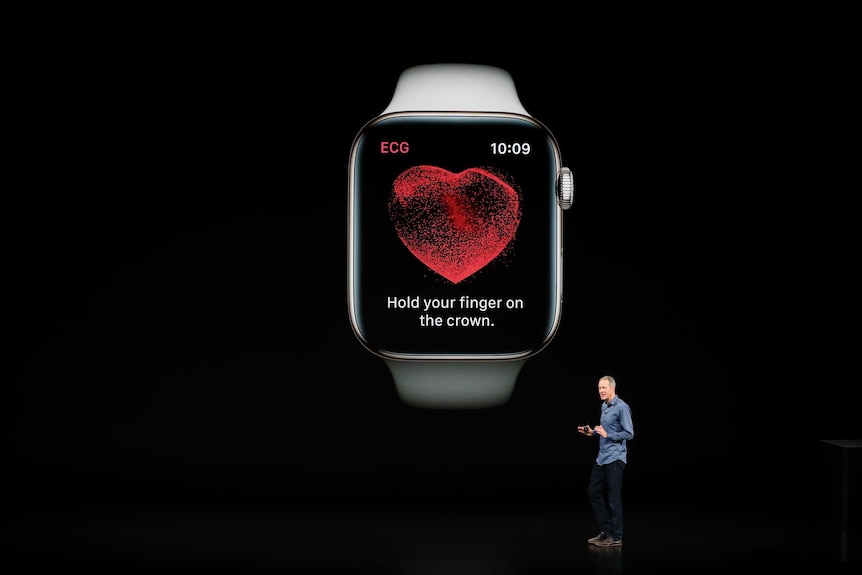 Jeff Williams, Chief Operating Officer of Apple stands on stage and introduces a new model of Apple Watch