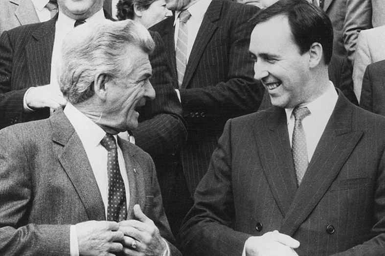 Bob Hawke and Paul Keating laugh together.